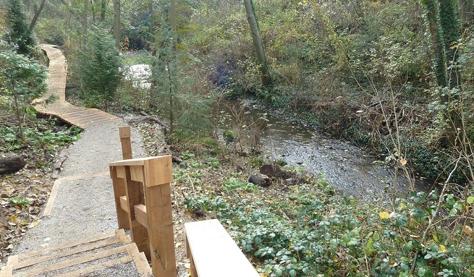 The boardwalk runs along Still Creek.